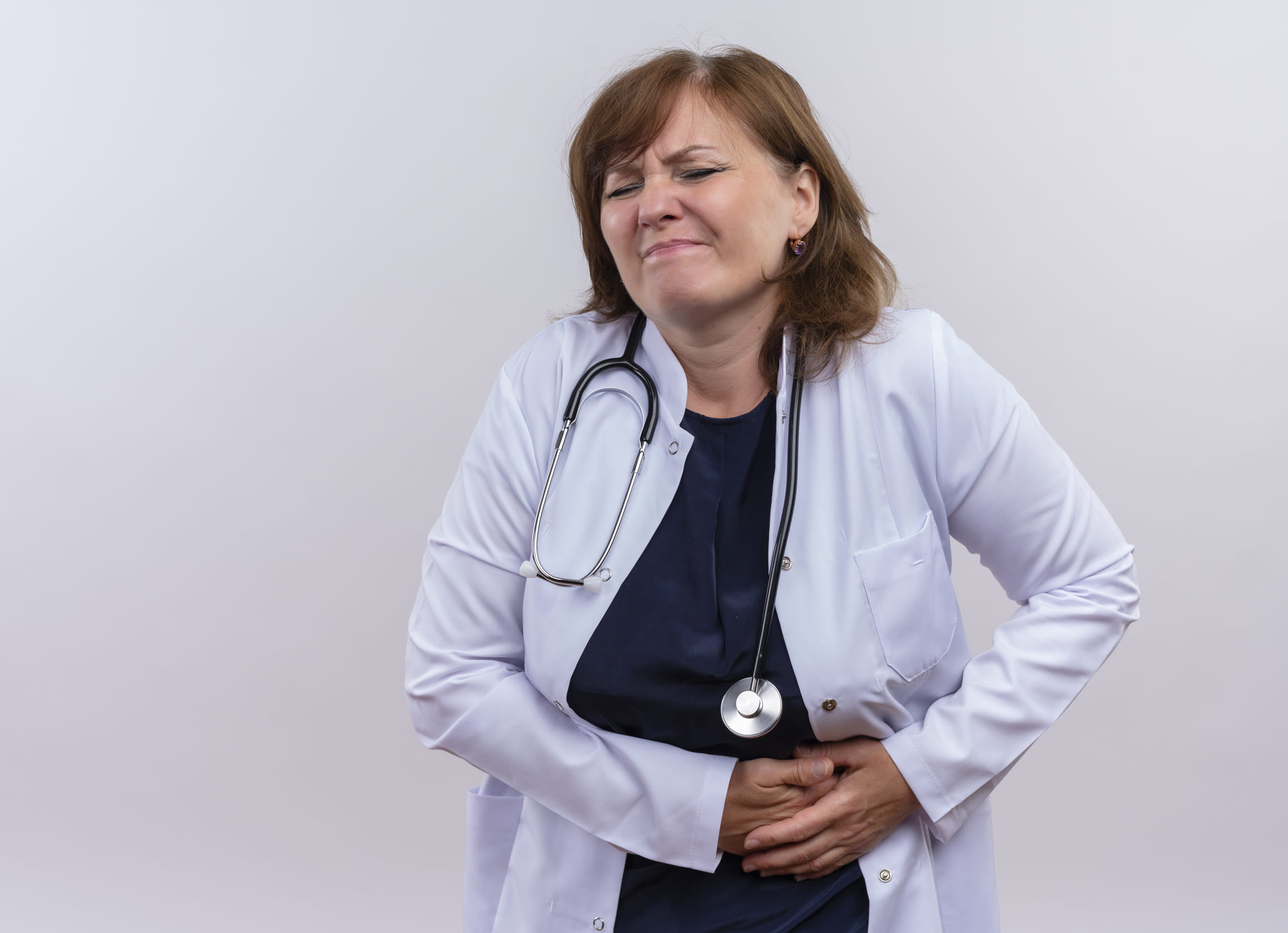 Woman doctor suffering from kidney pain isolated